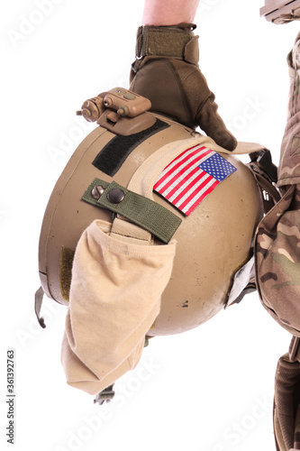 American soldier holds a helmet in his hands. isolated on a white background. remedy. armor. American flag.