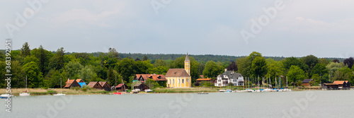 Panorama view on the lakeshore of Lake Ammer with catholic church St. Alban. photo