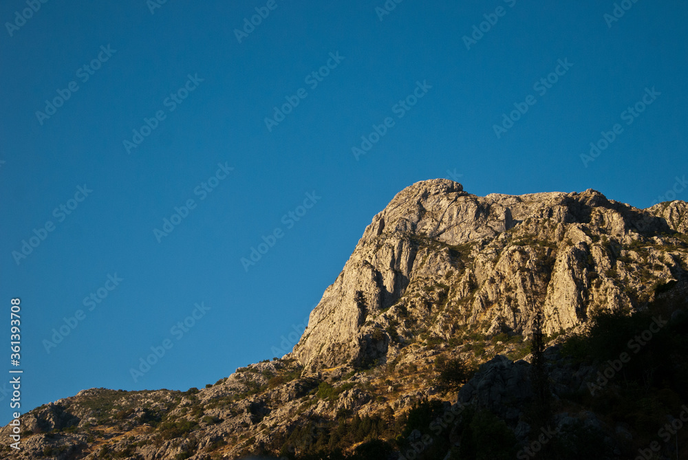 Mountain lit by the setting sun evening Mountain lit by the setting sun evening