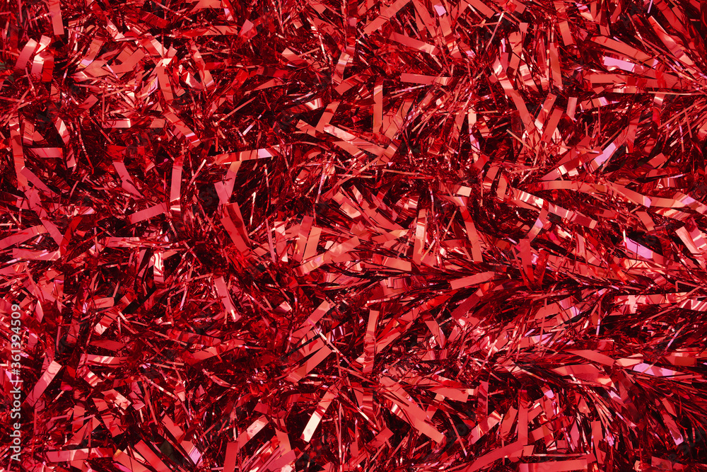 red christmas tinsel as background red christmas tinsel as background