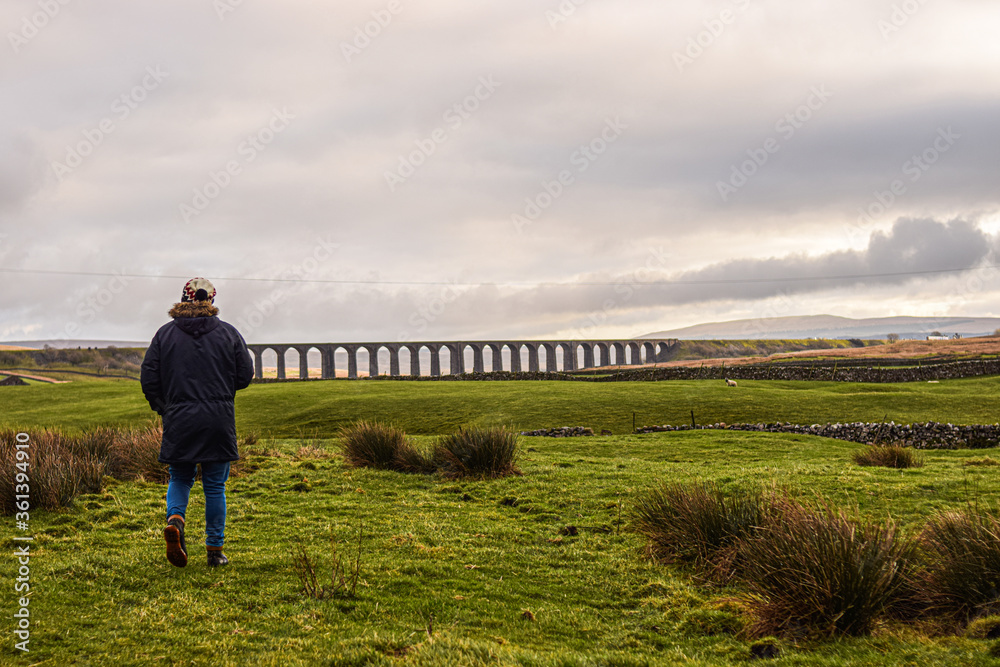 Photo of an impressive and big Ribblehead Viaduct in the middle of nature in UK