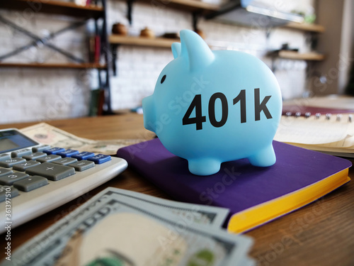 401k pension plan concept. Piggy bank and money at the kitchen.