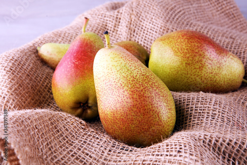 Fresh ripe organic pears on table, natural background, vega, diet food.