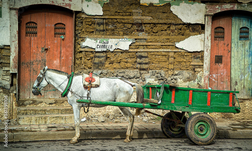 Horse drawn cart outside old building facade, Masaya, Nicaragua