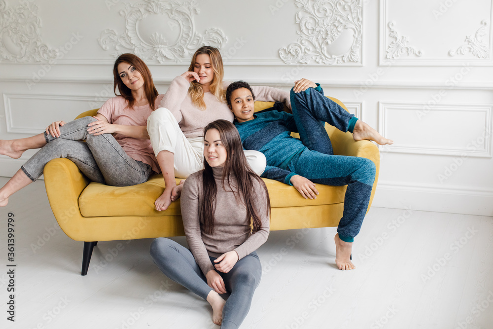 A diversity of girlfriends. International friendship of girls, girls at home. body positive and people concept A diversity of girlfriends. International friendship of girls, girls at home. body positive and people concept