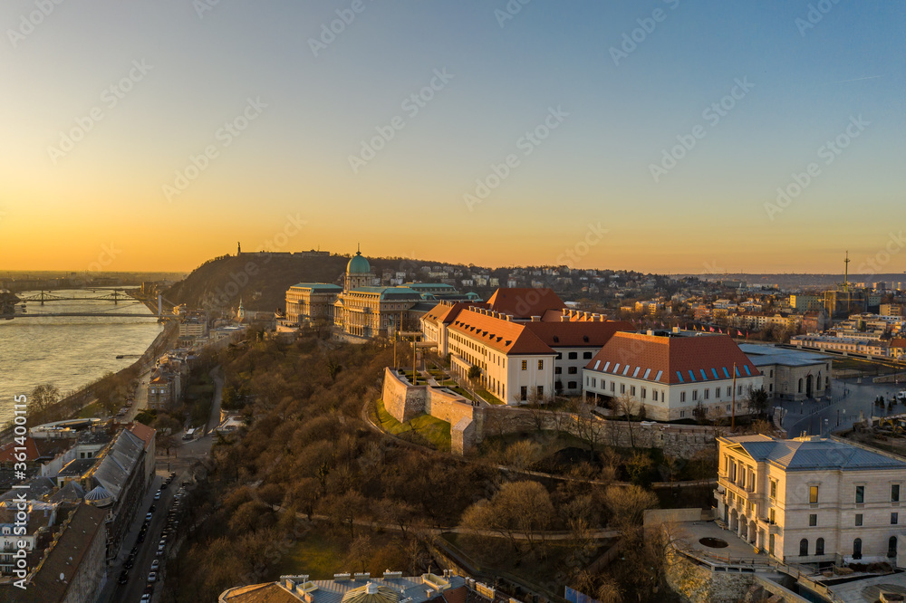 Aerial drone shot of Buda castle on Buda hill during Budapest sunrise morning glow