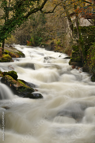 Streams and rapids of river in long exposure in Galicia