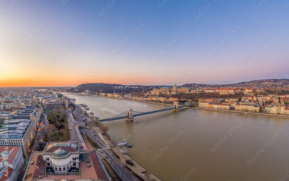Aerial drone shot of chain bridge over danube river Buda castle before Budapest sunrise