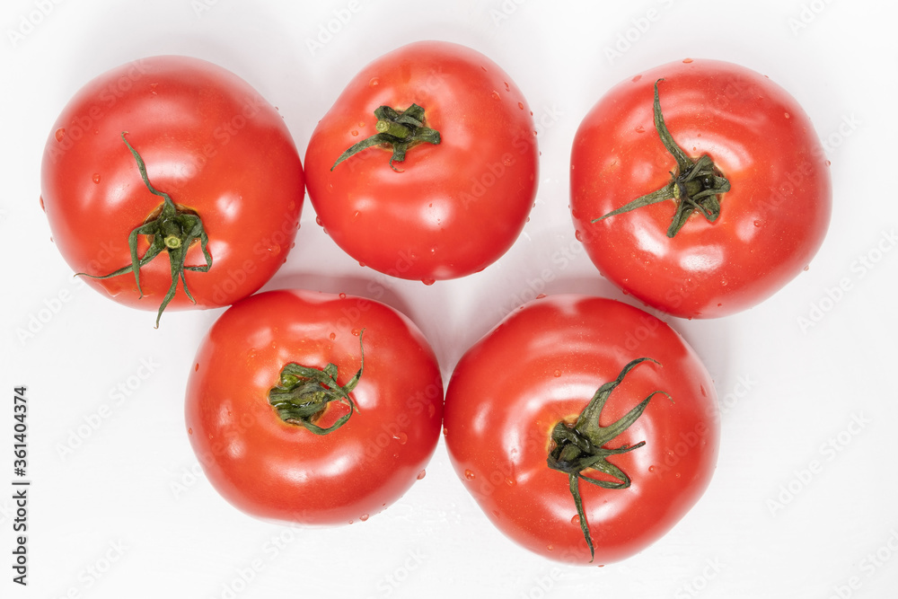 fresh tomatoes on a white background and summer vegetables fresh tomatoes on a white background and summer vegetables