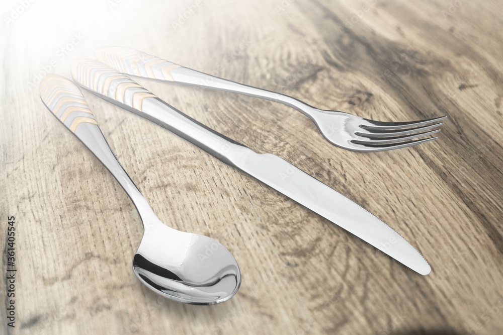 Classic metal spoon and folk on the desk Classic metal spoon and folk on the desk