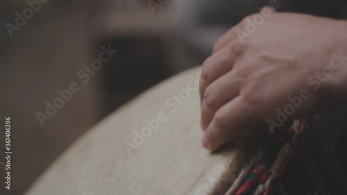 Close up view of hands playing music at djembe drums. photo