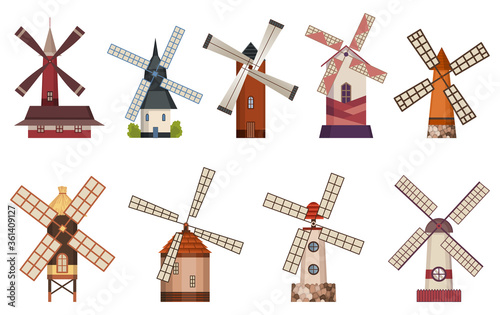 Collection of traditional ancient windmill buildings. Rural organic agricultural production, ecological food manufacturing, clean energy concept, wind mill farm. Medieval european windmill