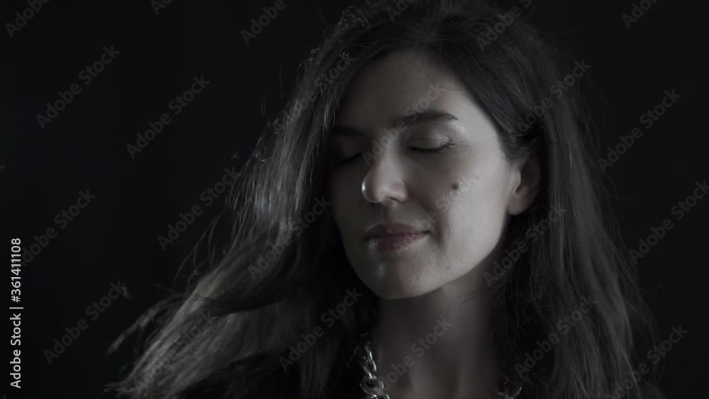Portrait of young beautiful European lady on black background. Isolated woman face shot. Portrait of young beautiful European lady on black background. Isolated woman face shot.