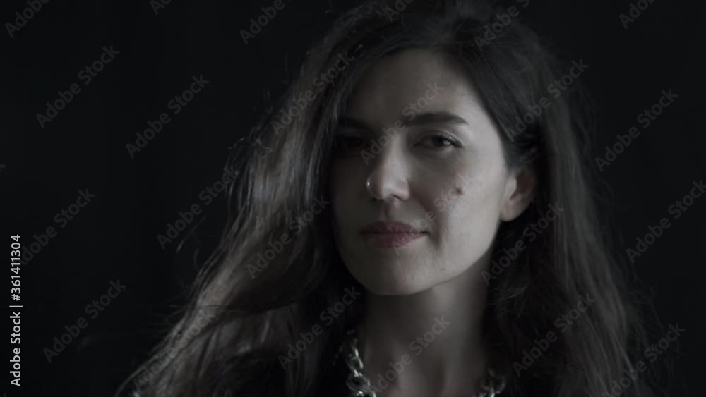 Portrait of young beautiful European lady on black background. Isolated woman face shot. Portrait of young beautiful European lady on black background. Isolated woman face shot.