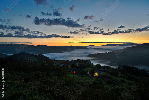 Sunrise in mountains and valley covered by fog in Galicia
