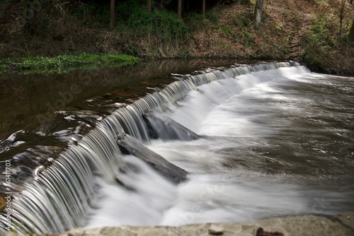 Streams and rapids of river in long exposure in spring in Galicia