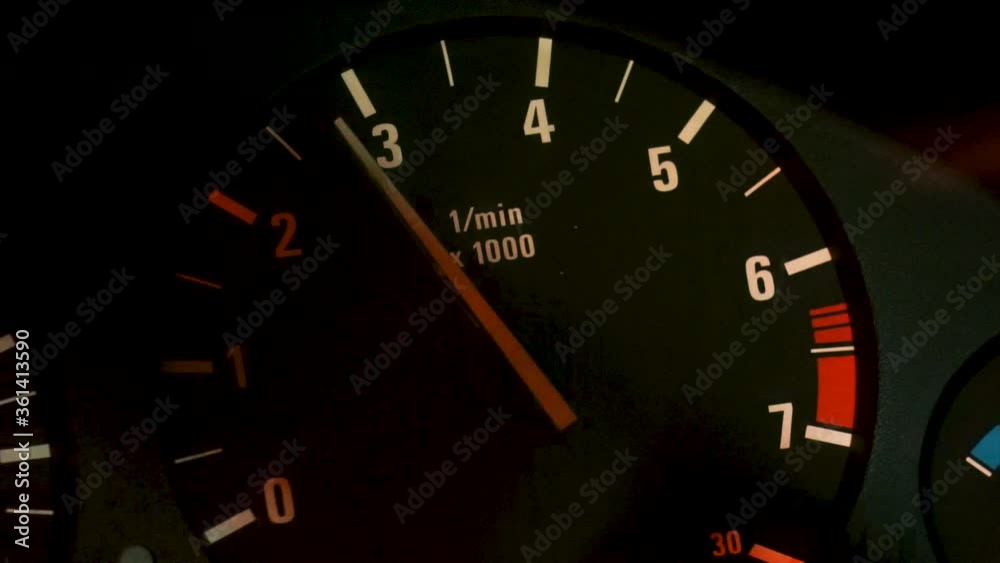 Car dashboard and speedometer with moving red arrow on zero while the automobile is accelerating. Footage. Close up of the car dial, concept of transportation. Car dashboard and speedometer with moving red arrow on zero while the automobile is accelerating. Footage. Close up of the car dial, concept of transportation.