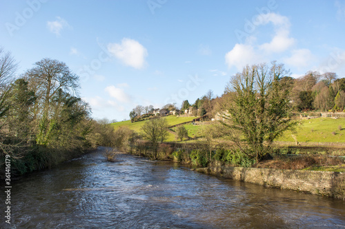 River bank and houses in Derbyshire, UK