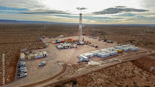 Vaca Muerta, Argentina, December 23, 2016: Extraction of unconventional oil. Battery of pumping trucks for hydraulic fracturing (Fracking).