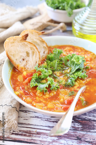 Spicy split pea soup with cabbage kale, olive oil and bread