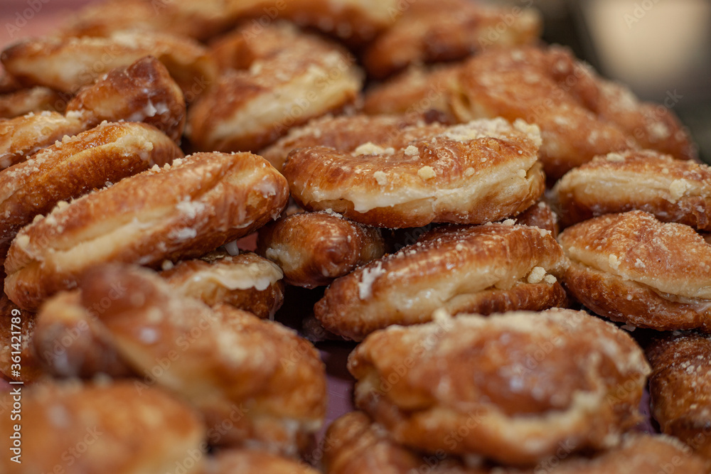 close up of a pile of doughnuts at a pastry shop