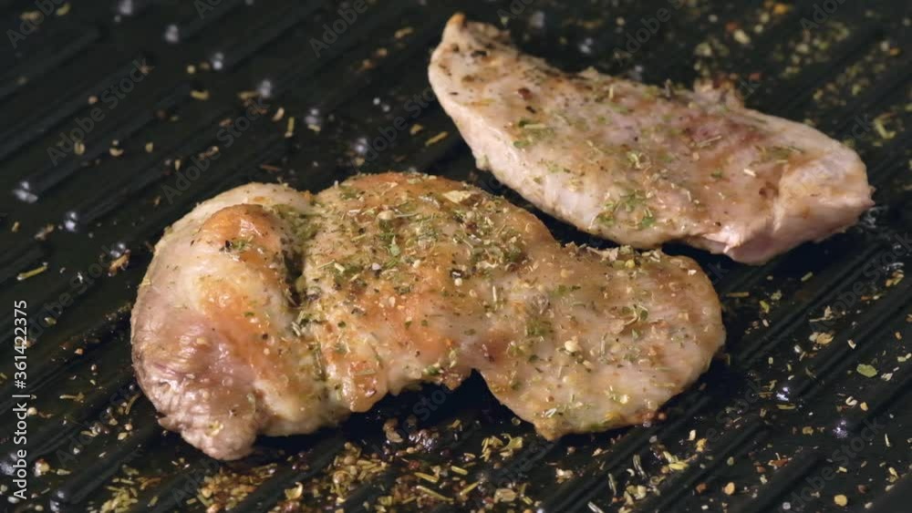 Grilling Chicken steak on a griddle. Grilling Chicken steak on a griddle.