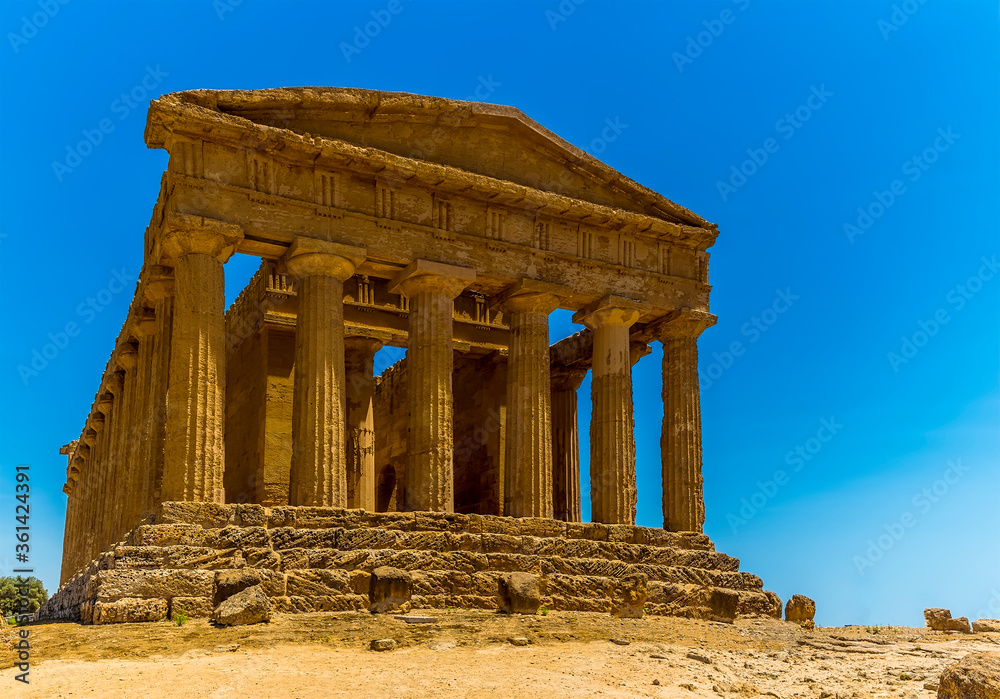 A close up perspective view of the west side of the Temple of Concordia in the ancient Sicilian city of Agrigento in summer