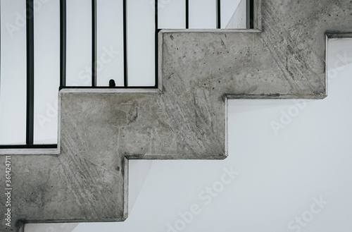 Concrete prefabricated stairs with black iron railing