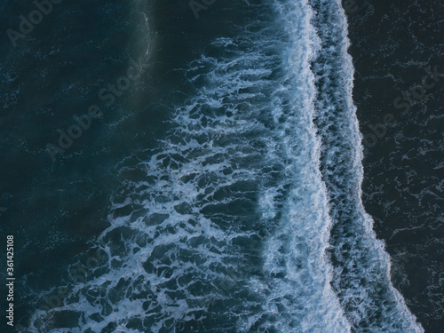 Aerial photo of waves breaking near a rural surf beach, New Zealand.  © Carl
