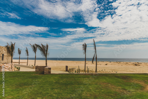 Colorful Panoramic Landscape, Blue sky, beach and palms. Los Cabos , Mexico