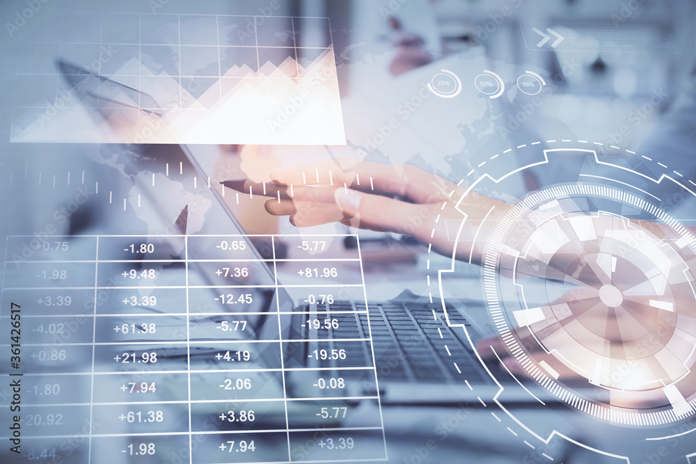 Multi exposure of woman hands typing on computer and financial graph hologram drawing. Stock market analysis concept.