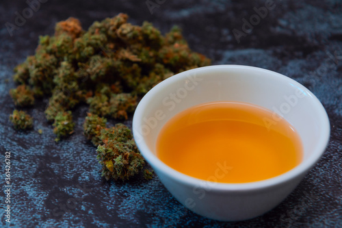 Cannabis buds with bowl of canna tea-3 photo