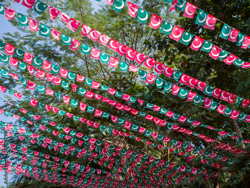 Small flags of the Indian Union Muslim League are hung over the streets of Goa. India. photo