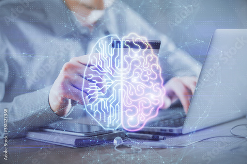 Double exposure of man hands typing on computer with credit card and brain theme drawing. E-commerce and AI concept.