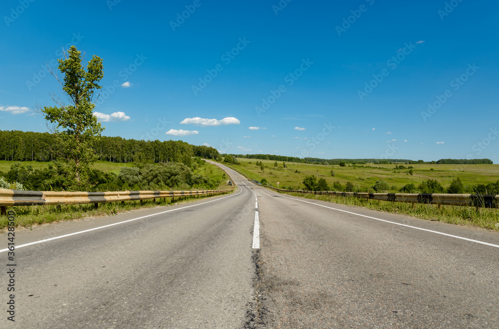 Beautiful road through the mountains in summer Beautiful road through the mountains in summer