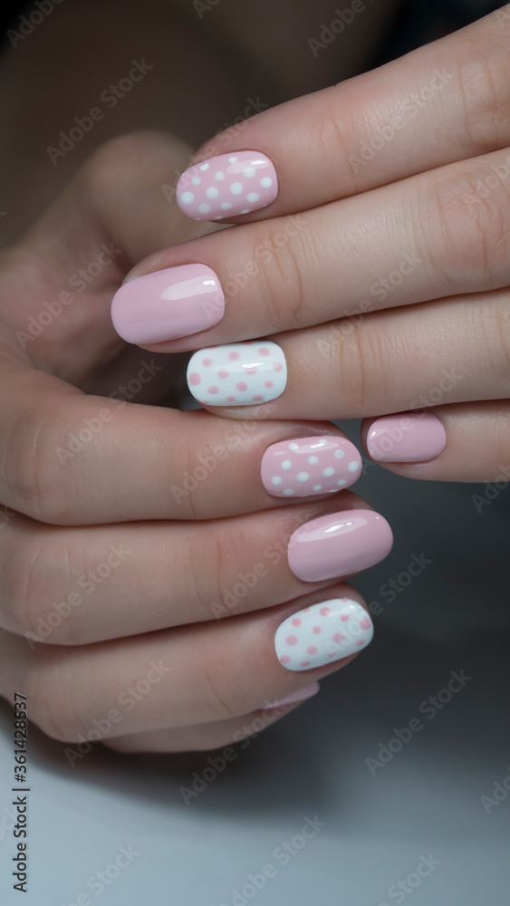 pink and white nail polish. Nail design with white dots on pink nail polish pink and white nail polish. Nail design with white dots on pink nail polish