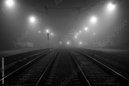 night road in fog, long exposure, black and white, dark image