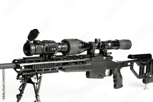 Weapon for hunting with a mounted optical sight, on a white background.