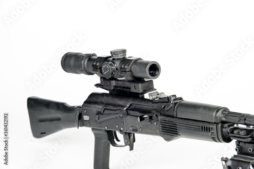 Weapon for hunting with a mounted optical sight, on a white background.