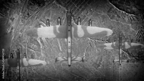 bombers fly over the ruined terrain and the city. World War II in the air. photo