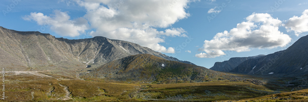 Mountain landscape, lake and mountain range, large panorama, Subpolar Urals. The concept of outdoor activities and tourism. Beautiful landscape.