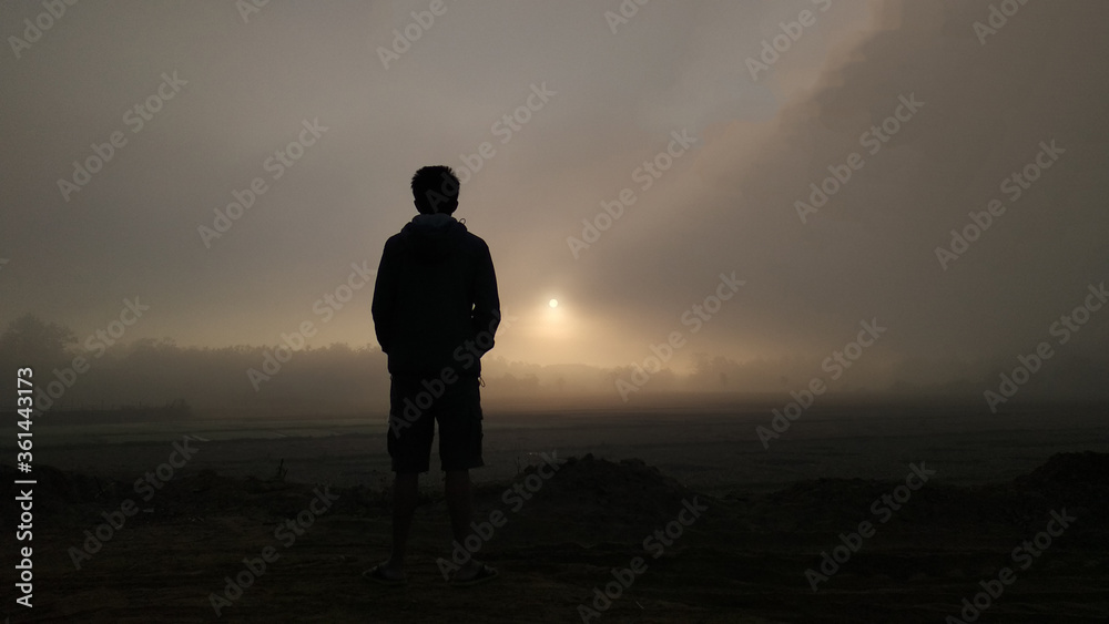man walking in the fog