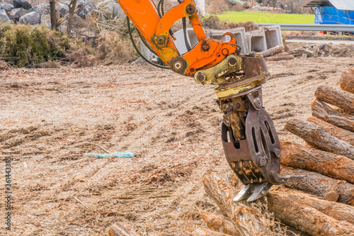 Backhoe log grapple attachment
