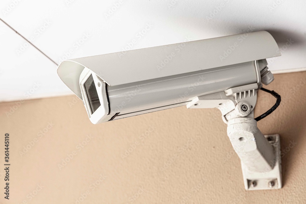 Video camera security system on the wall of the building