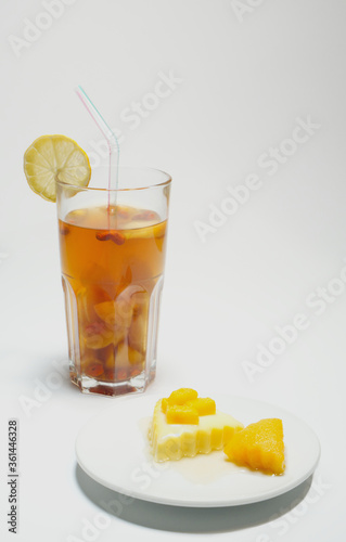 Mango pudding and iced tea with lemon, homemade refreshments, afternoon tea