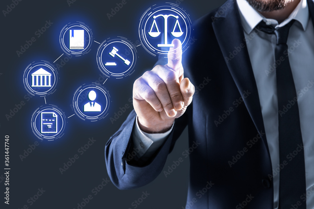 Laws, legal information and online consultation. Man using virtual screen with icons, closeup Laws, legal information and online consultation. Man using virtual screen with icons, closeup