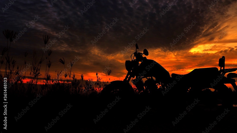 Motorcycle silhouette at sunset time