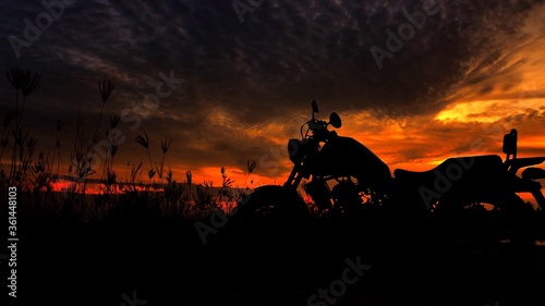 Motorcycle silhouette at sunset time photo