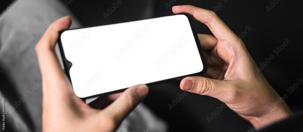 Hand holds smartphone in the night. Hand holds smartphone in the night.