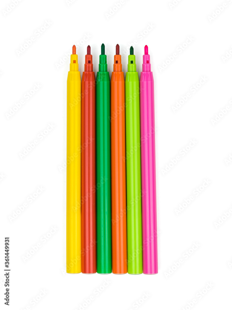 A set of markers with bright and warm colors isolated on a white background. A set of markers with bright and warm colors isolated on a white background.
